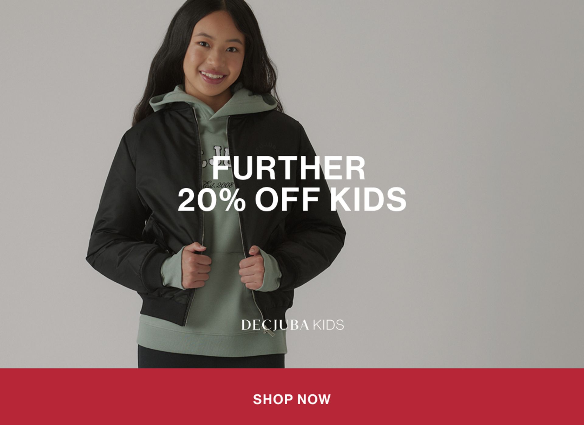 Model wearing a pink sweat set in a studio. Text reads FURTHER 20% OFF KIDS.