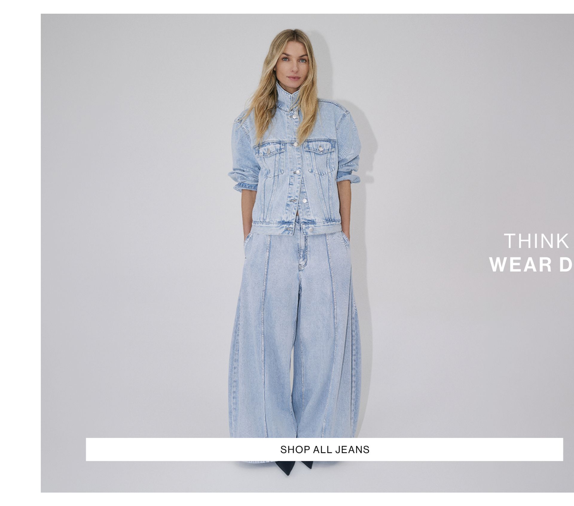 Jess Hart wearing the Nakita Denim Jacket and Paloma Jeans in light blue. SHOP JEANS.