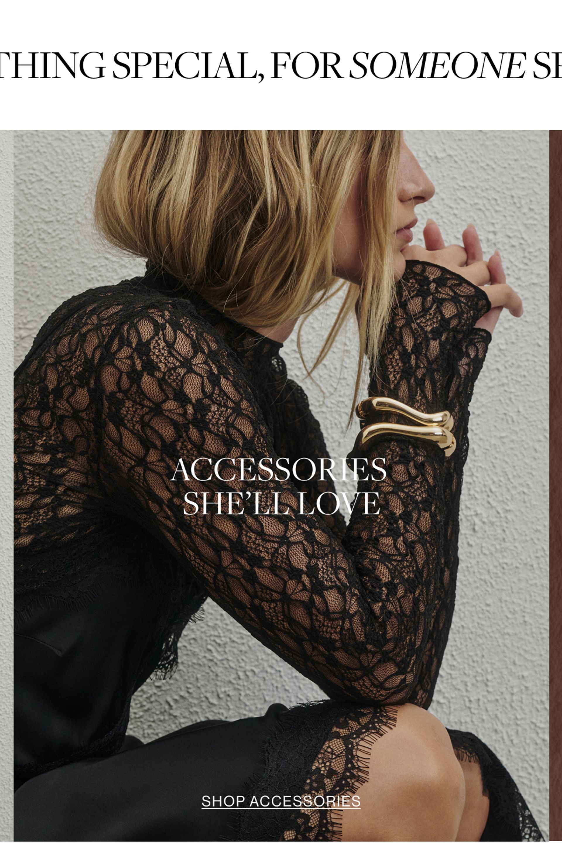 Close up shot of model wearing a black lace long sleeve top with a gold bangle with text overlay: "ACCESSORIES SHE'LL LOVE"