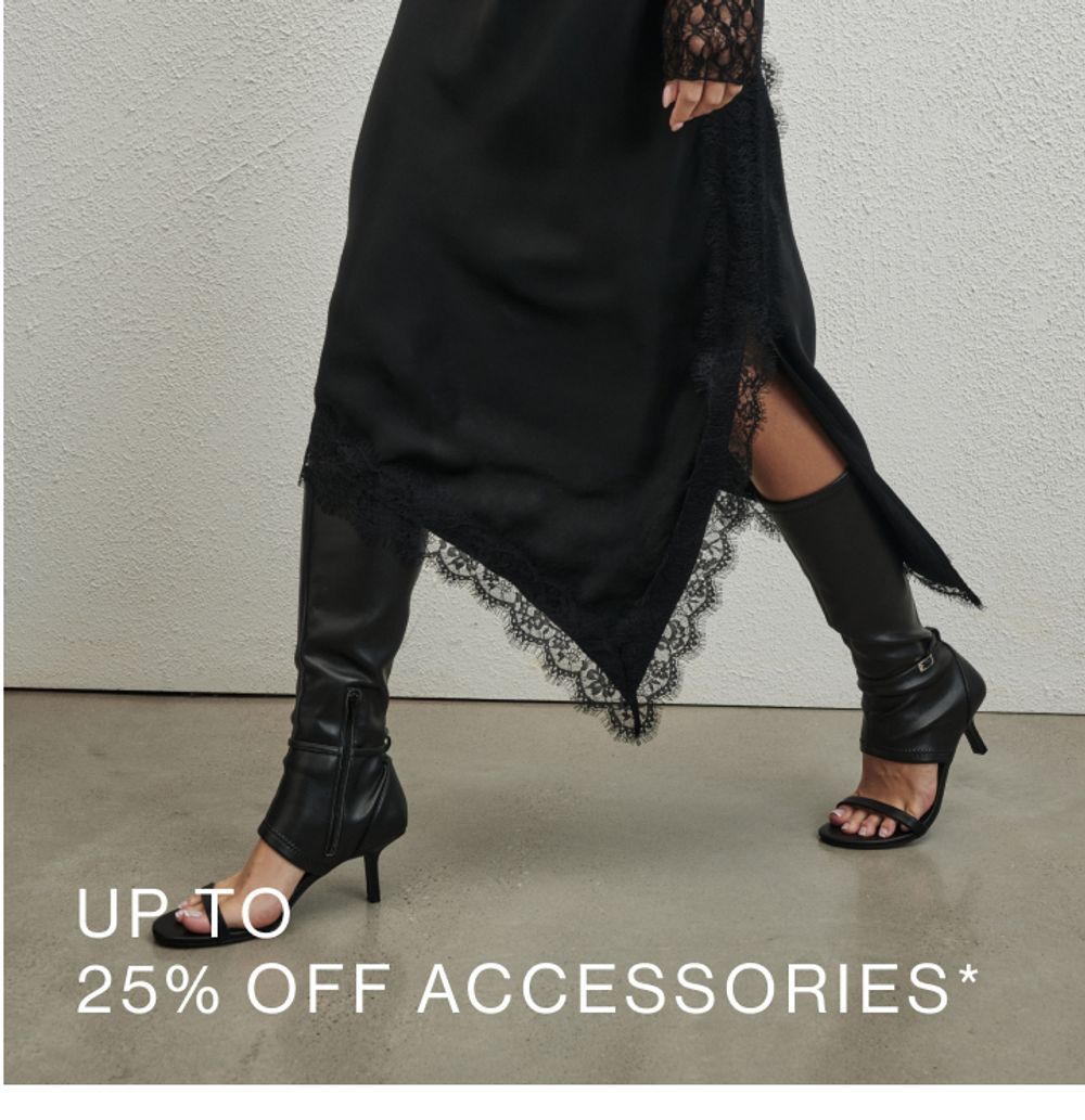 Model wearing black open toe buckle detail heel. SHOP 25% OFF ACCESSORIES.