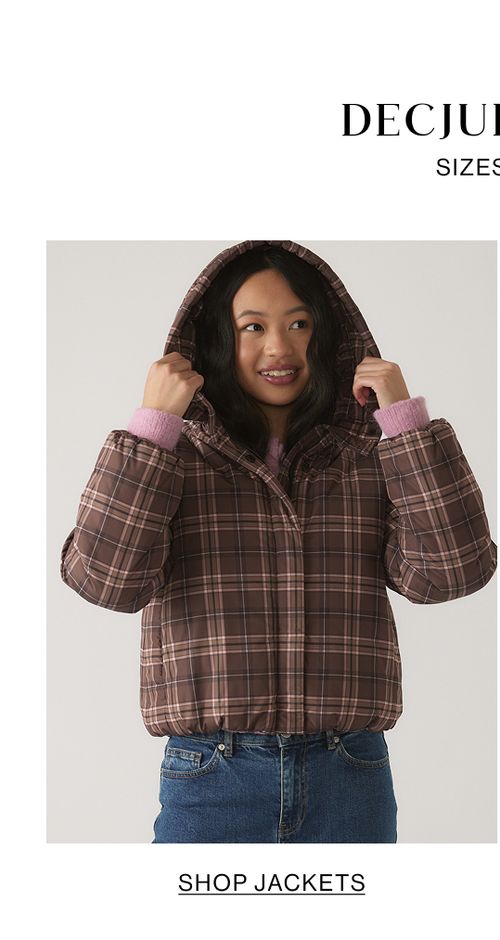 Child wearing a brown checkered jacket with text that states DECJUBA KIDS