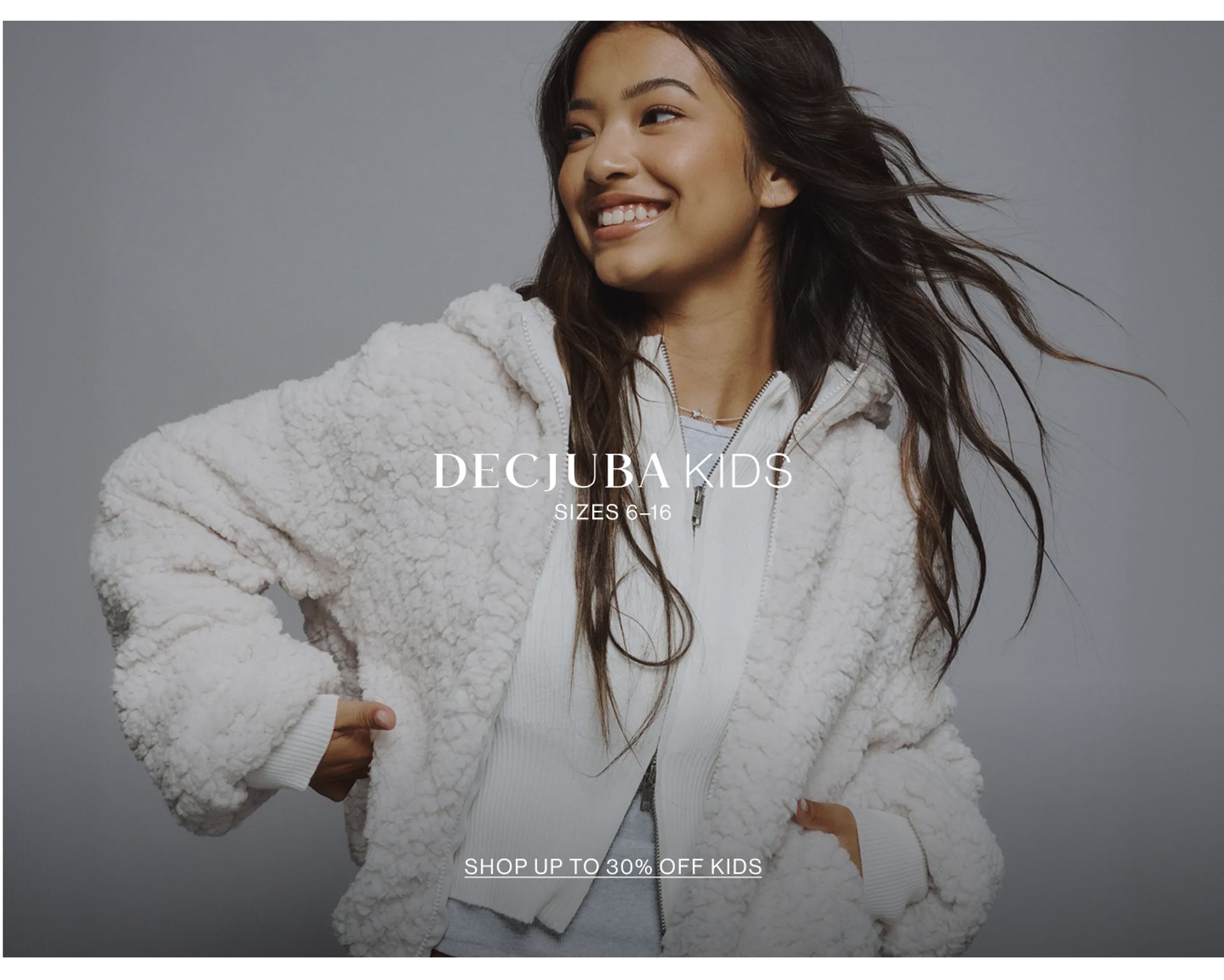 Image of young model wearing a stripe knit with text overlay: "DECJUBA KIDS SIZES 6-16"