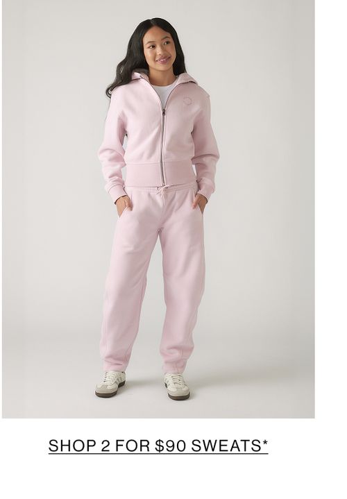 Young model wearing a pink sweat set. SHOP 2 FOR $90 SWEATS.