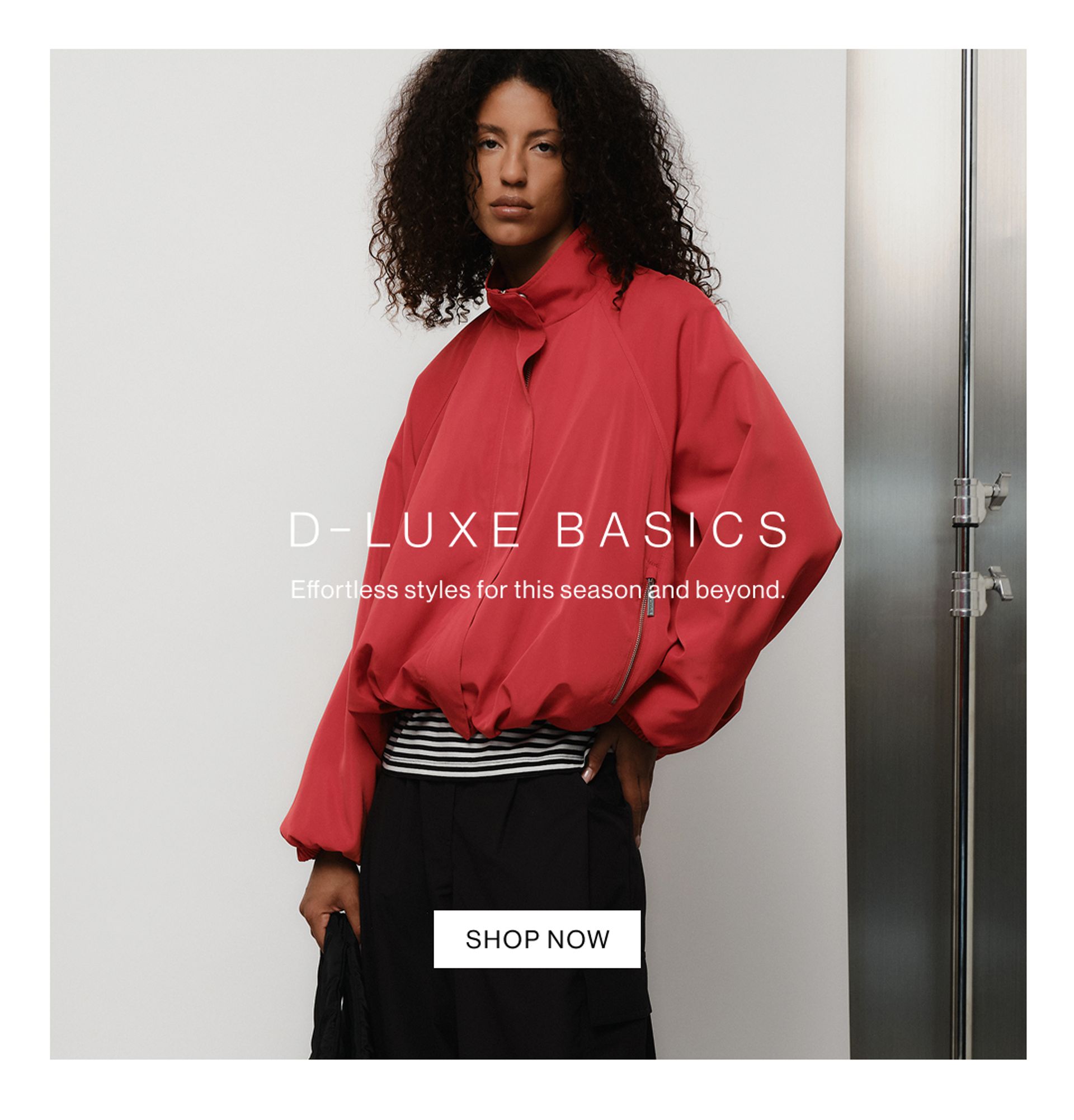 Blonde model smiling in a blue denim zip jacket and matching jeans – D-Luxe Basics.