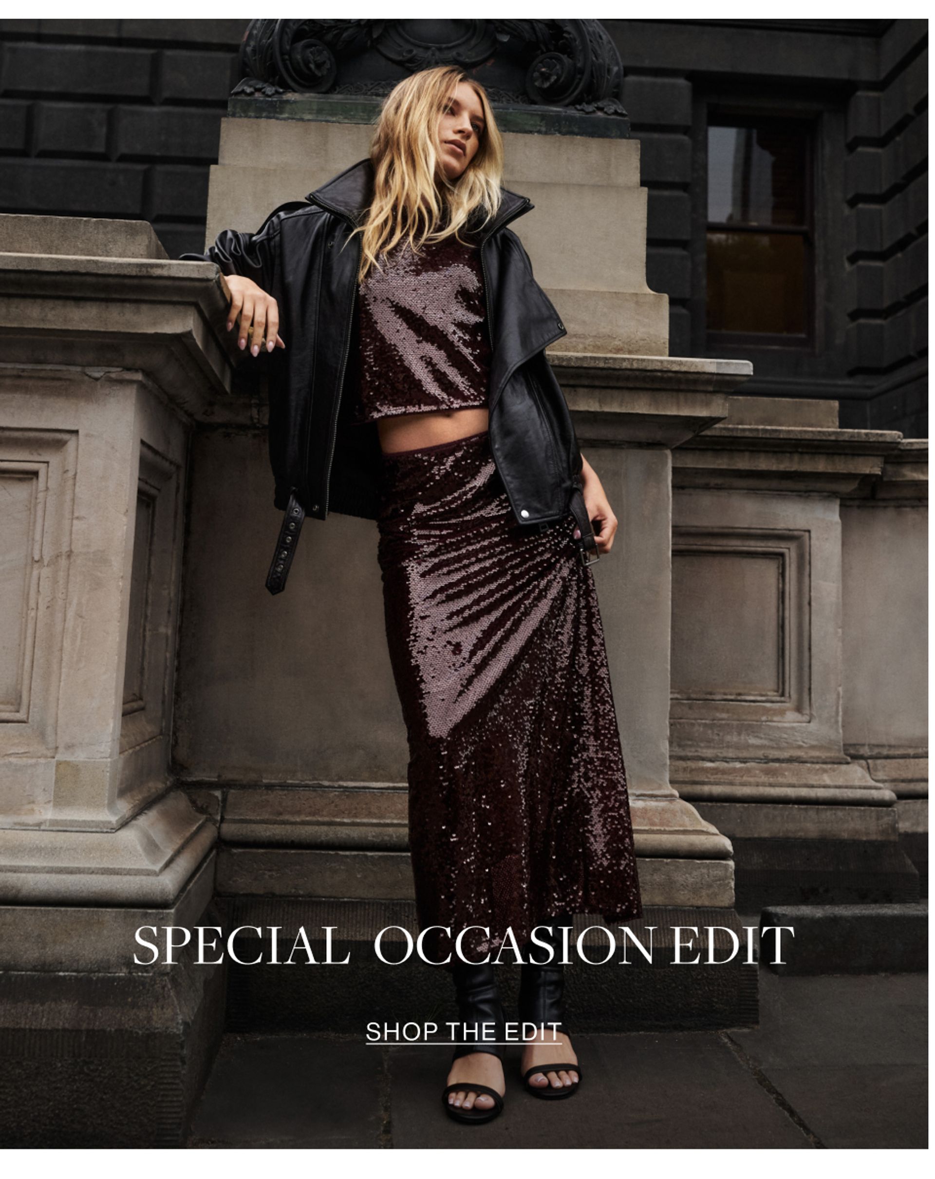 Model wearing a black leather jacket and black lace skirt. SHOP THE SPECIAL OCCASION EDIT.
