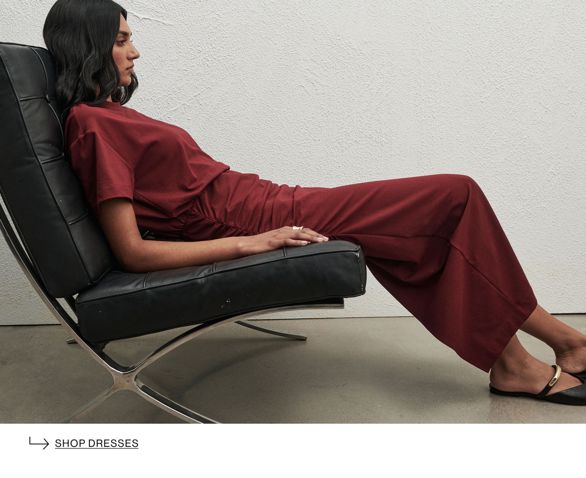 Woman in red dress on couch