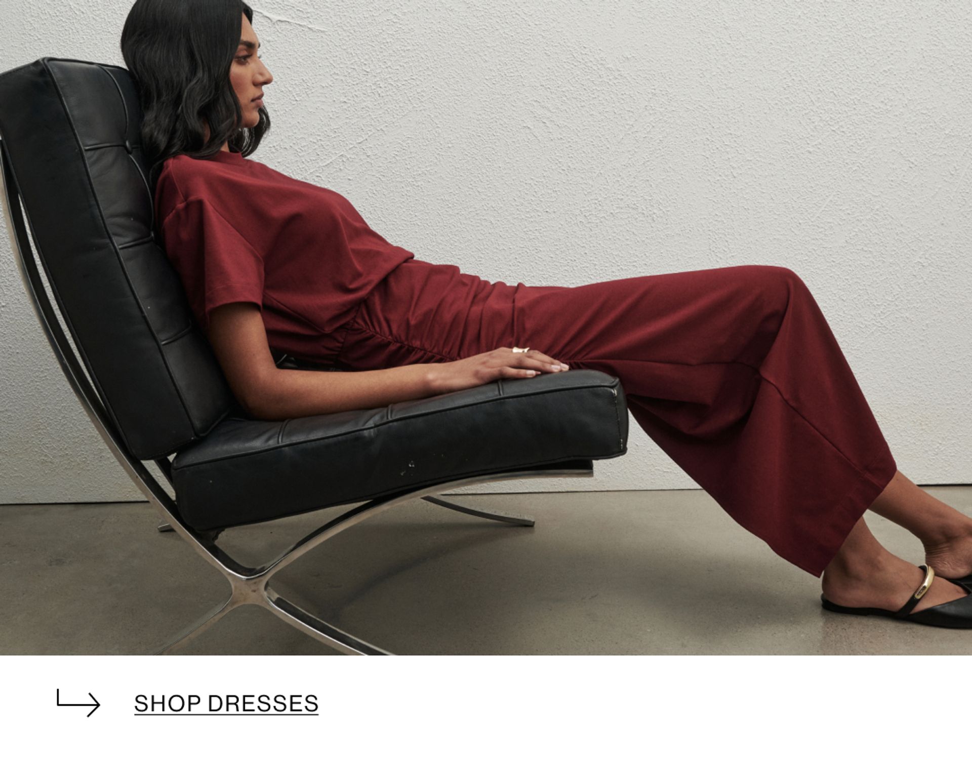 Woman in red dress on couch