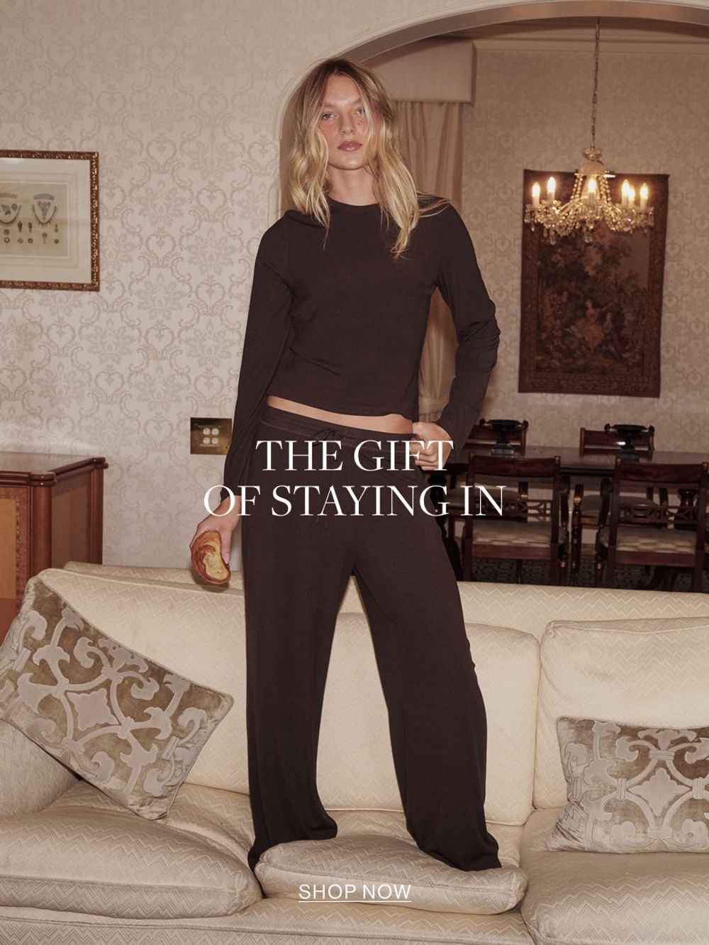 Woman in chocolate sleep set. Text reads the gift of staying in