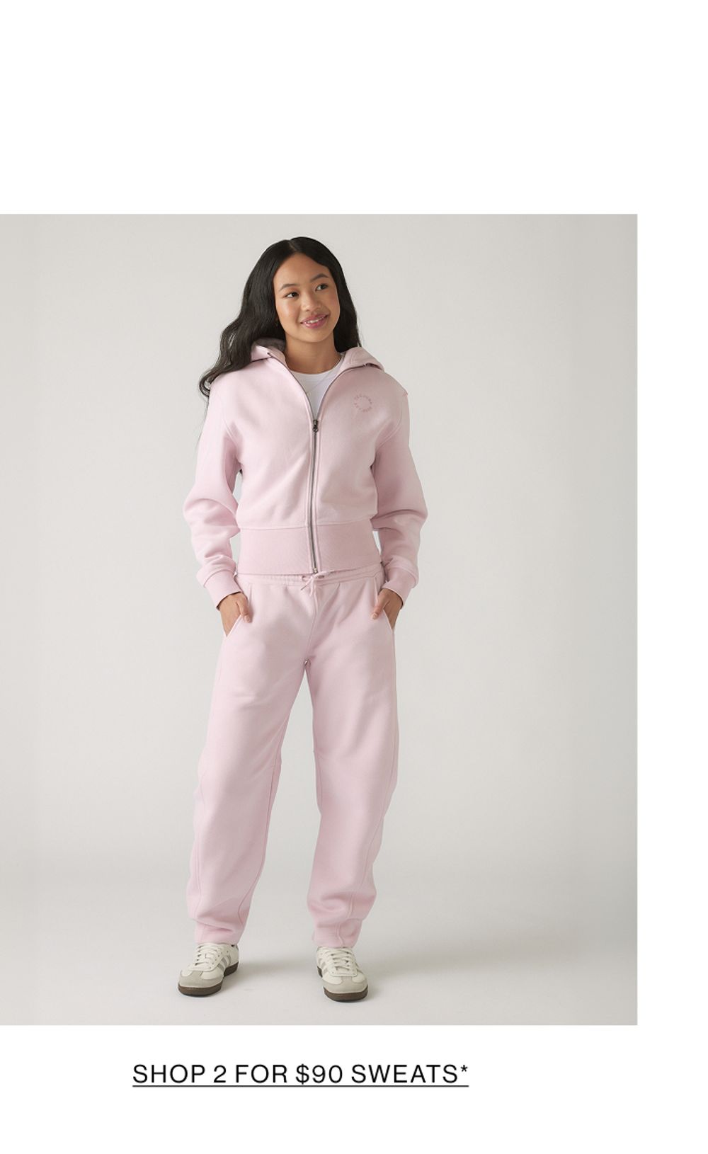 Young model wearing a pink sweat set. SHOP 2 FOR $90 SWEATS.