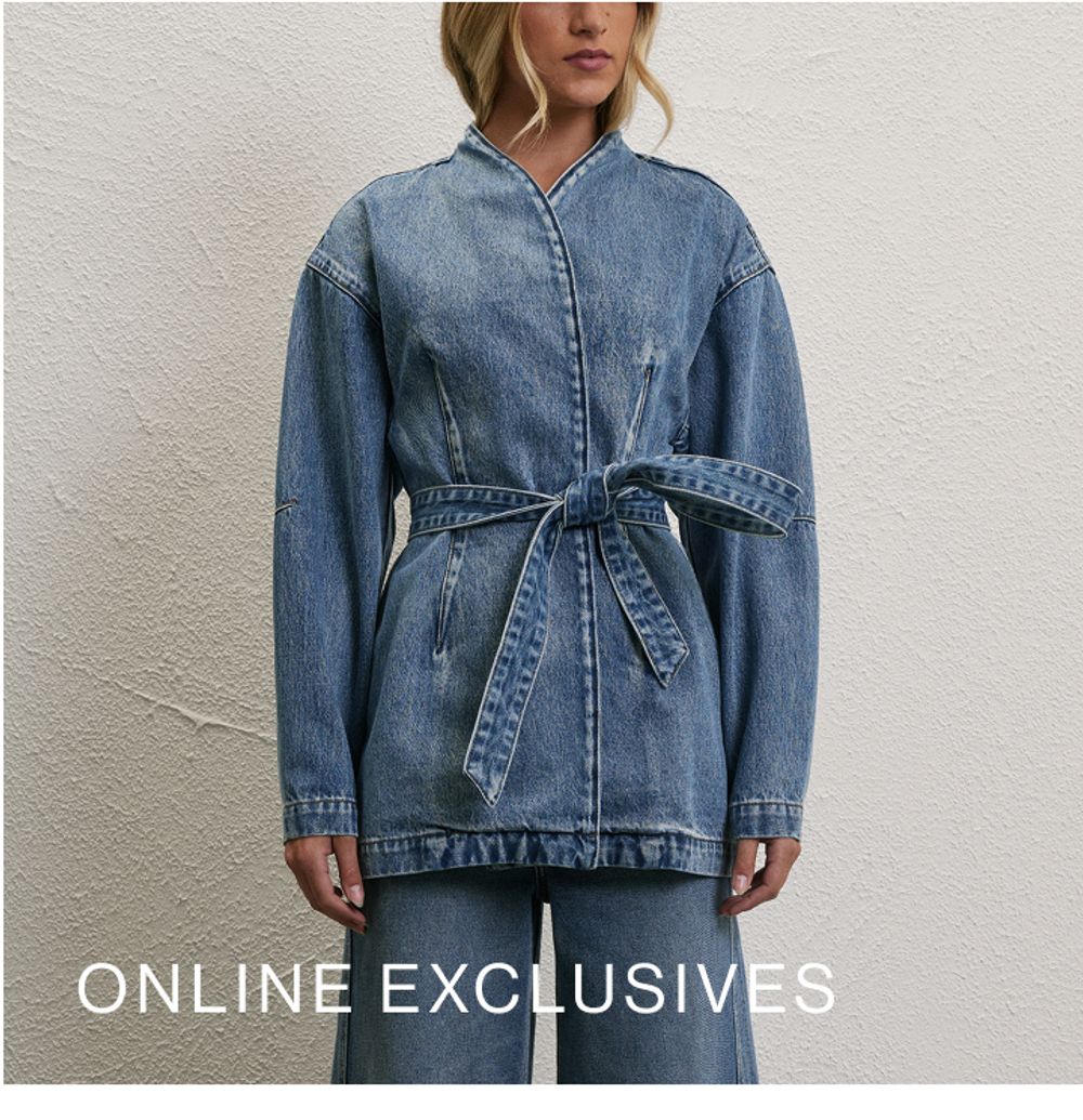 Model wearing a light blue denim wrap top with matching jeans. SHOP ONLINE EXCLUSIVES.