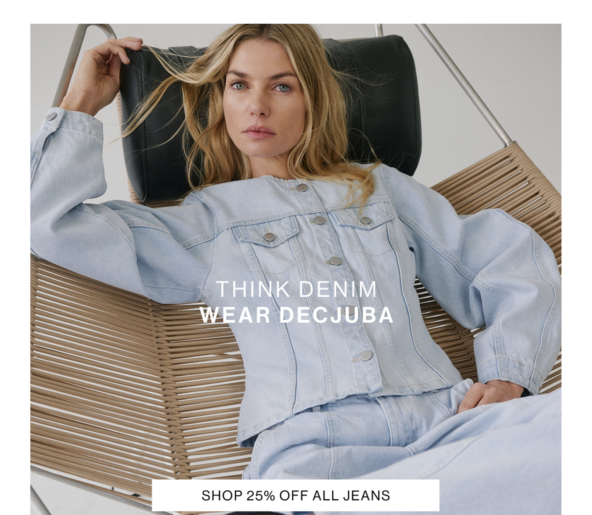 Model wearing a light blue denim jacket and wide-leg jeans set, promoting denim collection.