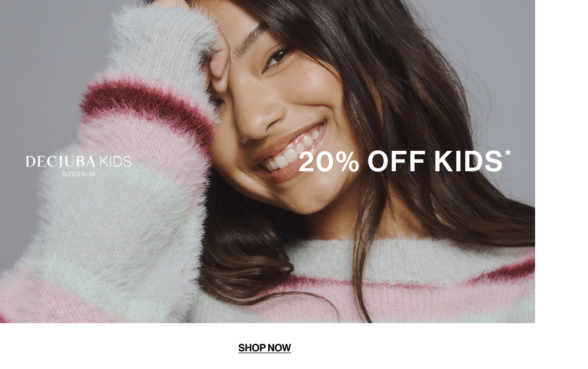 Model wearing a stripe knit in a studio. Text reads 20% off Kids.