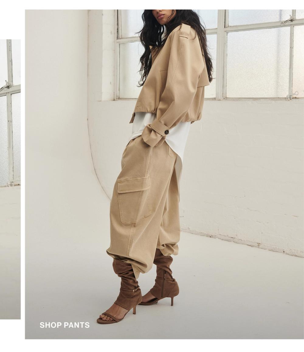 Model wearing a cashew pants. SHOP PANTS.