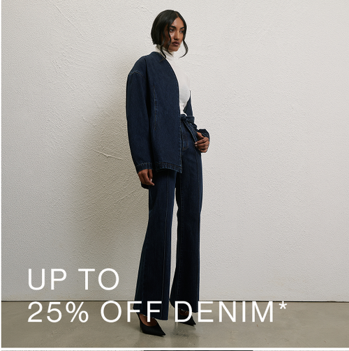 Model wearing a dark denim jacket and jeans. SHOP 25% OFF DENIM.