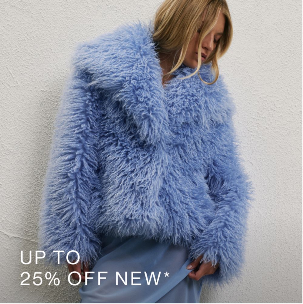 Model wearing blue faux fur jacket. SHOP 25% OFF NEW.
