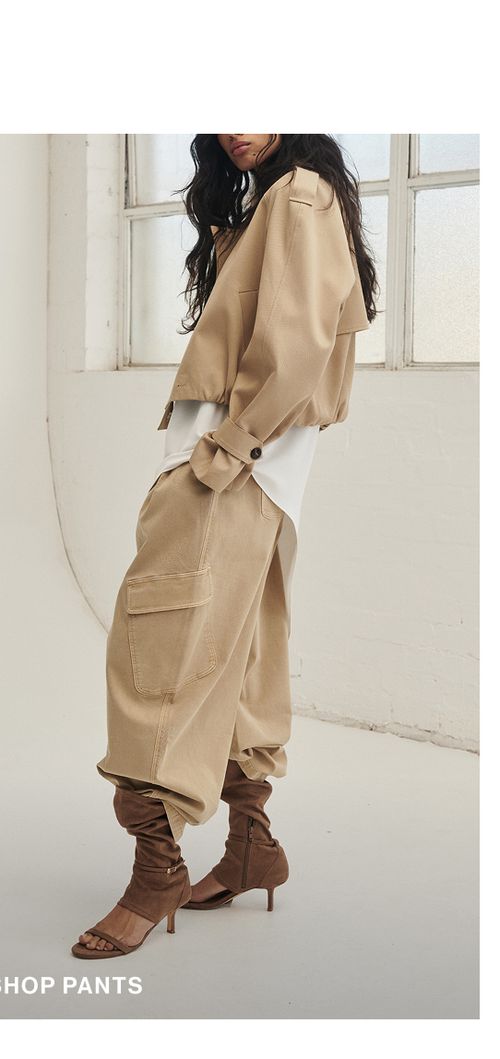 Model wearing a cashew pants. SHOP PANTS.