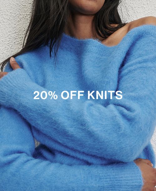 Model wearing a blue knit. Text reads 20% off knits.