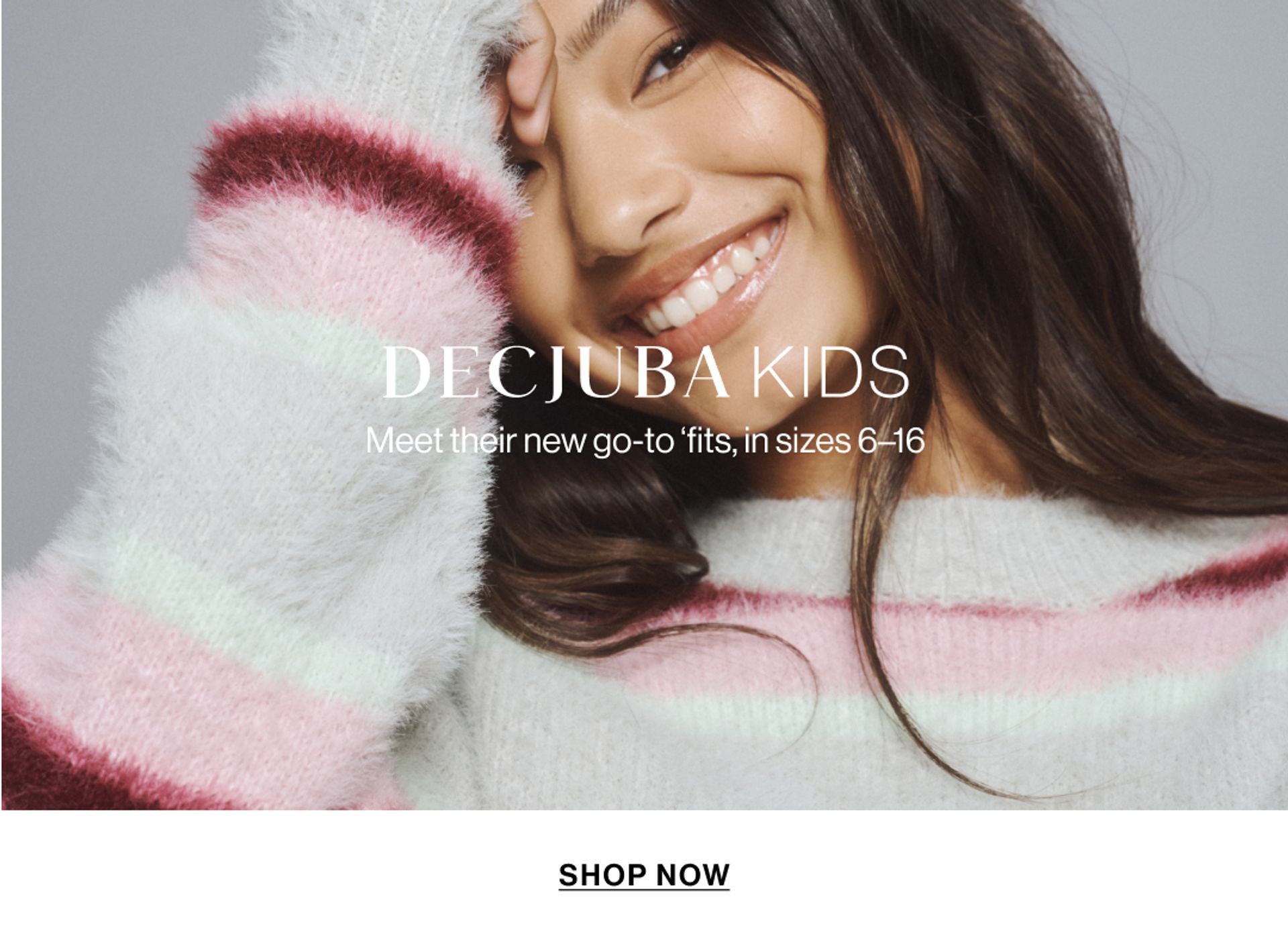 Model wearing a stripe knit in a studio. Text reads DECJUBA KIDS