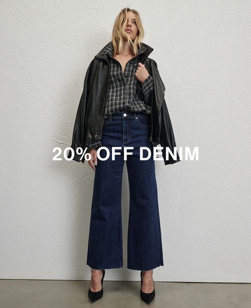 Model wearing a black long sleeve top and jeans. Text reads 20% off denim.