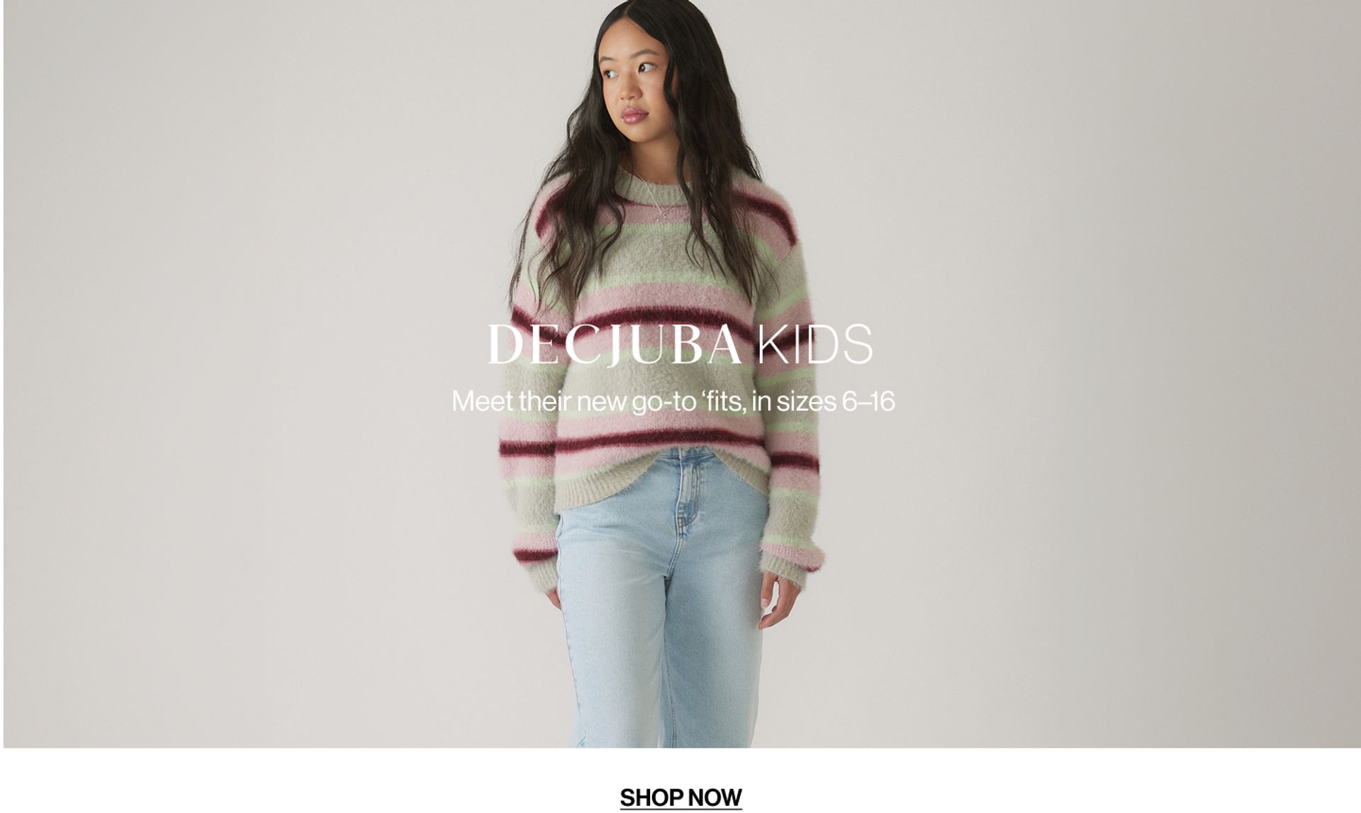 Model wearing a stripe knit in a studio. Text reads DECJUBA KIDS