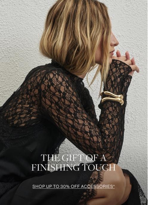 Woman in black dress and gold bangle. Text reads accessories she'll love