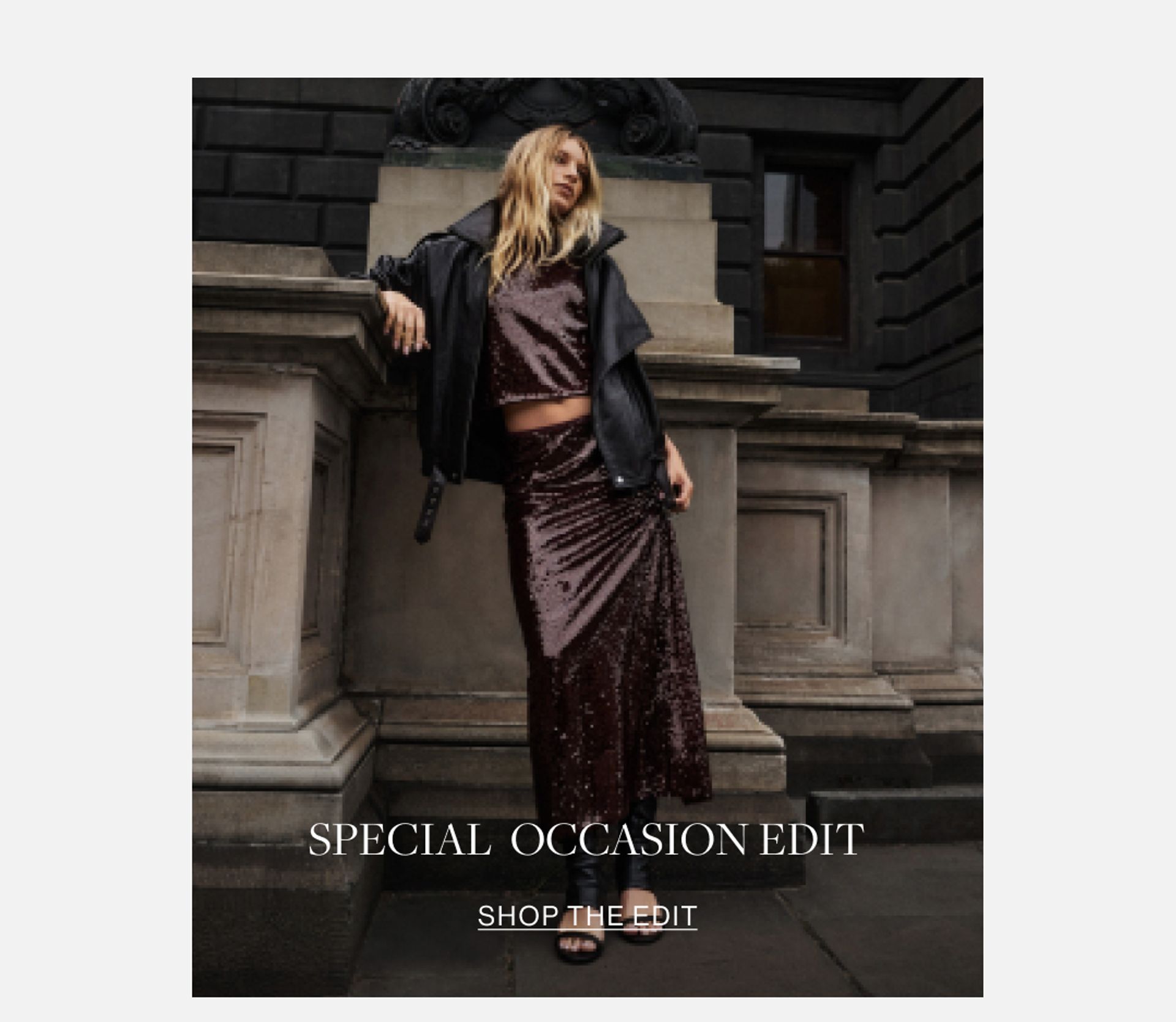 Model wearing a black leather jacket and black lace skirt. SHOP THE SPECIAL OCCASION EDIT.