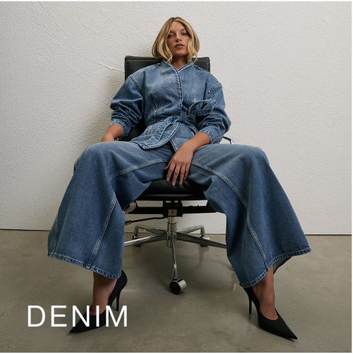 Model wearing a light denim jacket and jeans. SHOP DENIM.