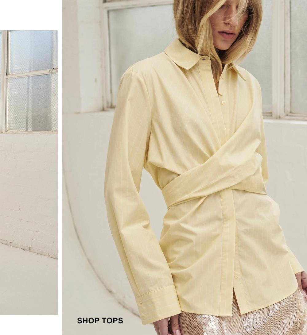 Model posing wearing a lemon coloured wrap shirt tee. SHOP TOPS.