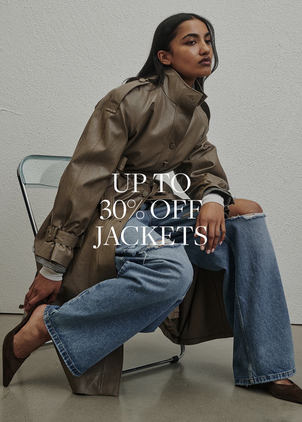 Model wearing a brown faux fur jacket. SHOP JACKETS.
