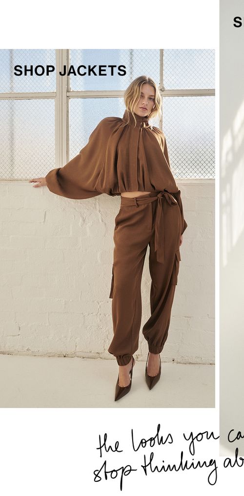 Woman standing in a brown funnel neck jacket