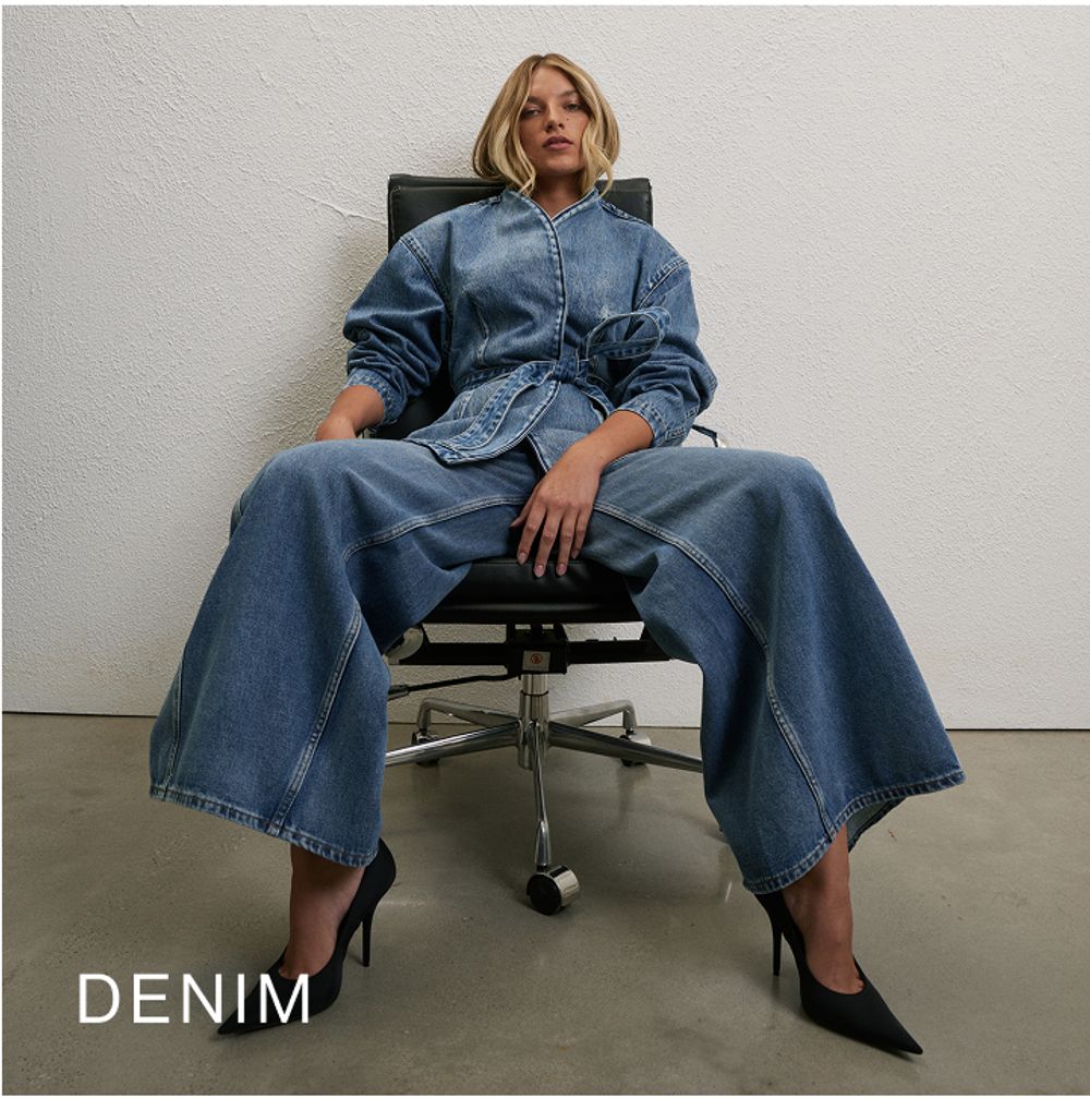 Woman sitting in a chair wearing a long sleeve denim set with text overlay which states "Denim"