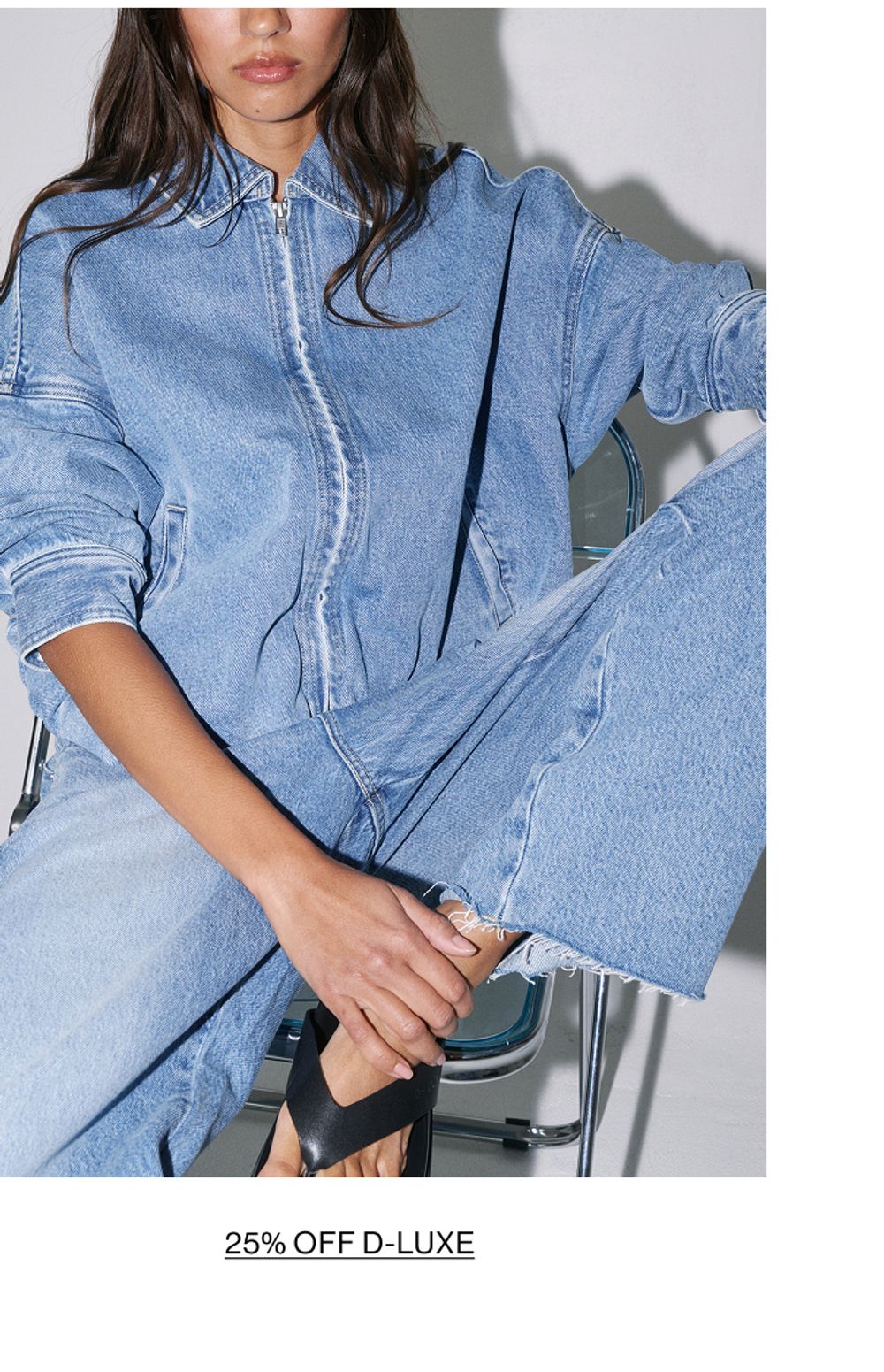 Woman posing in double denim with text that states shop Dluxe