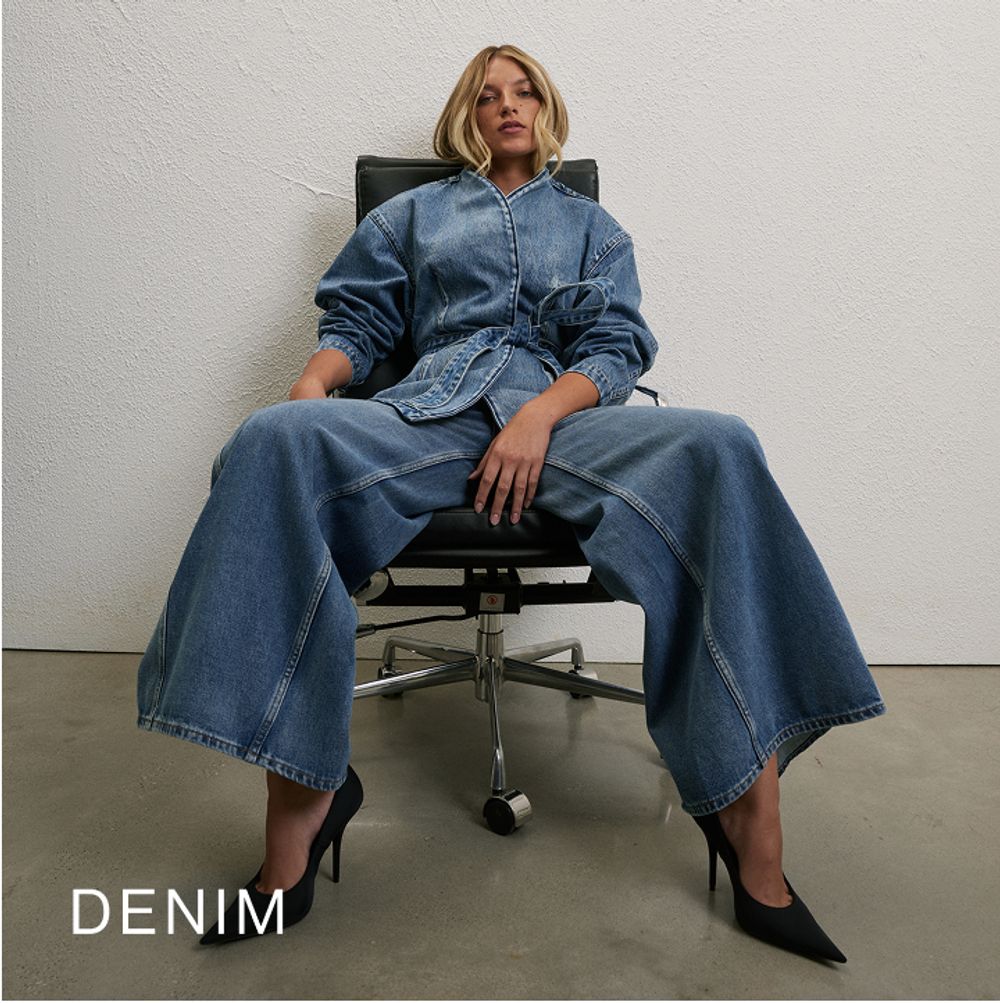 Woman sitting in a chair wearing a long sleeve denim set with text overlay which states "Denim"