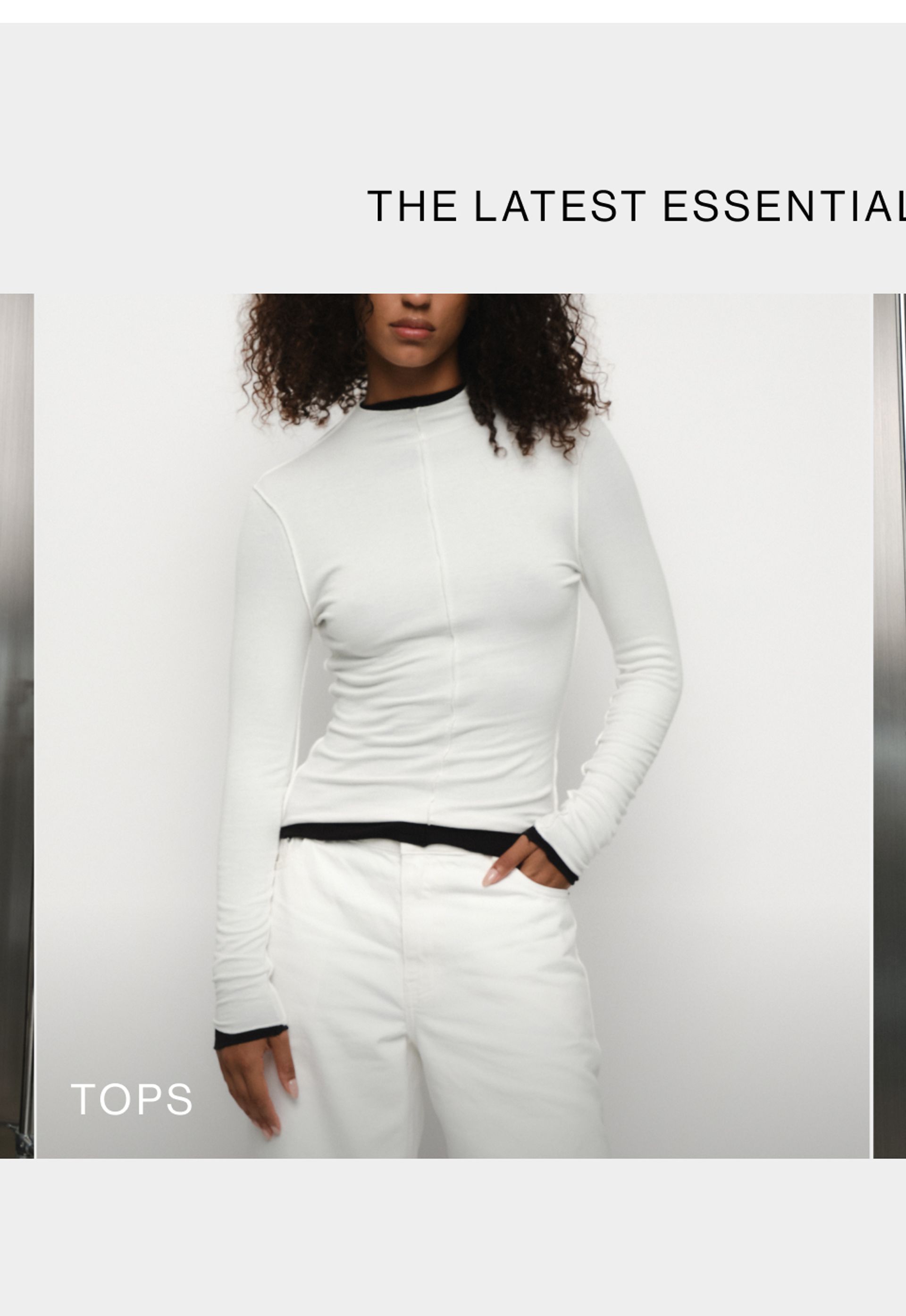 Woman wearing a white long sleeve top with text overlay which states tops