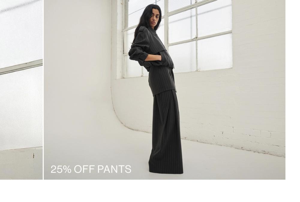 Woman posing in a pinstripe suit 