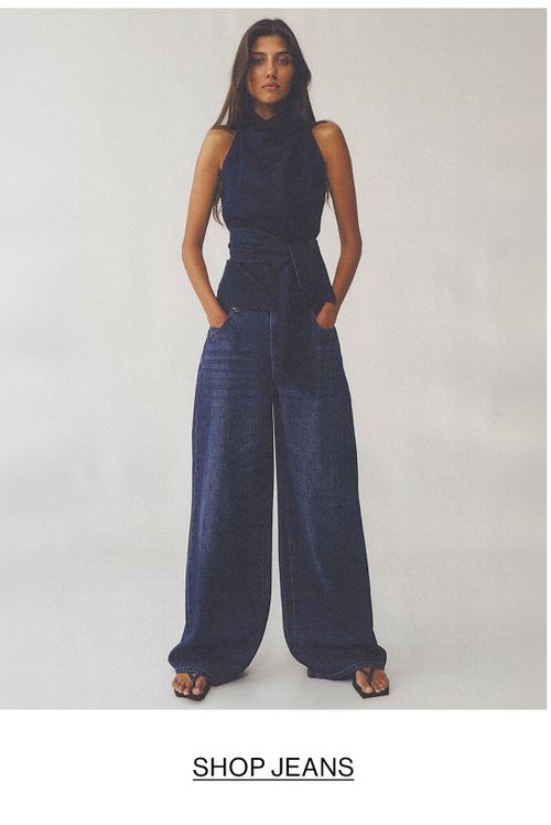 Woman in double denim with text overlay "SHOP JEANS"