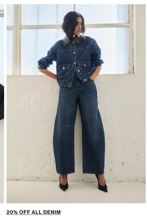 Woman posing in a matching denim set
