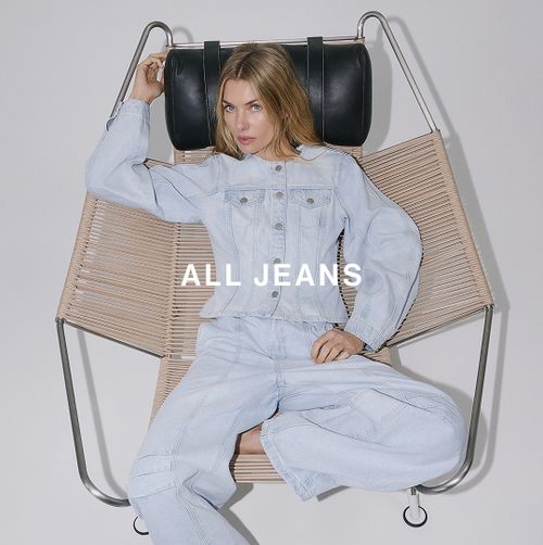 Woman sitting in a modern chair with text overlay all jeans
