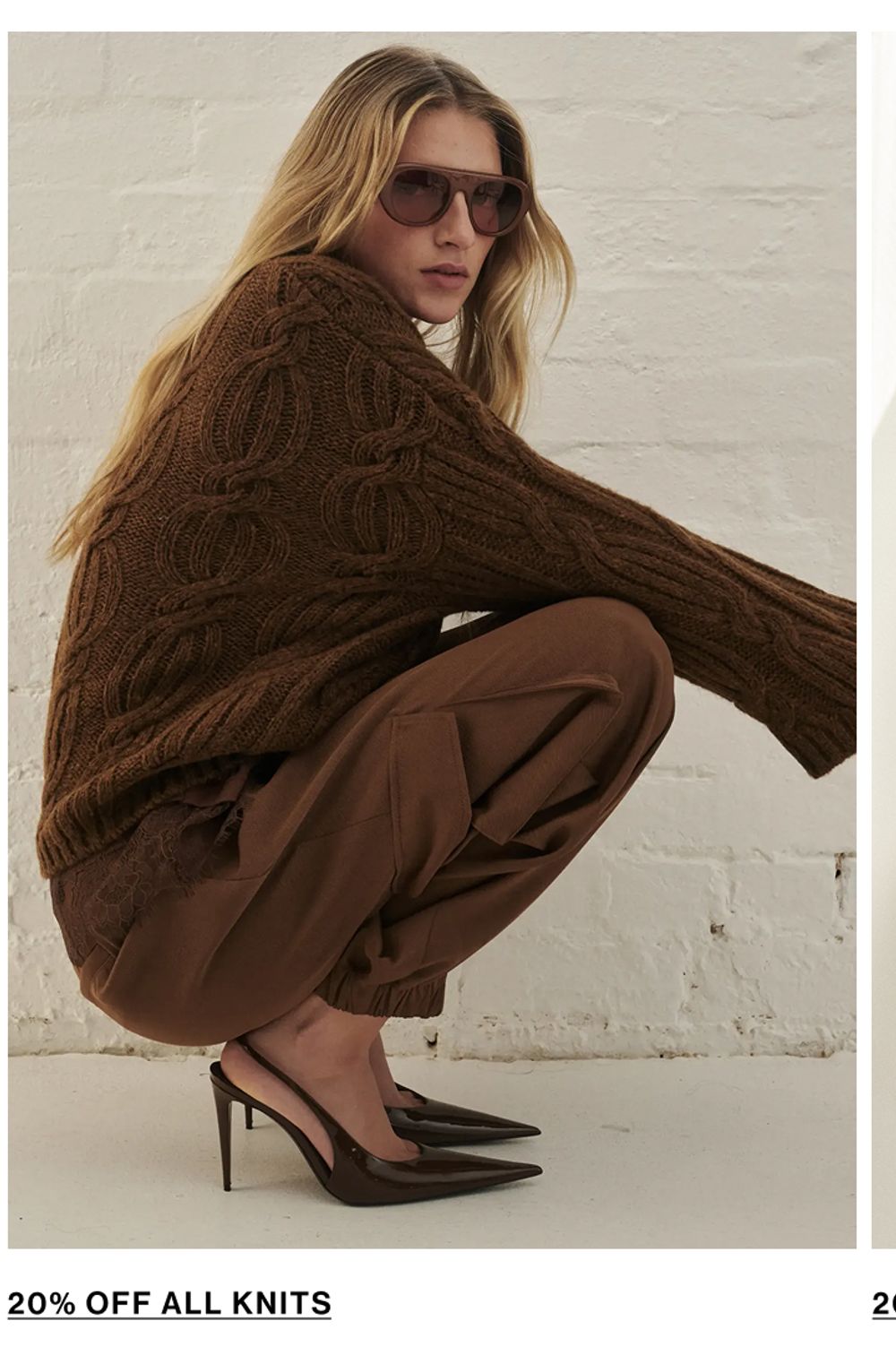 Woman posing in a black knit