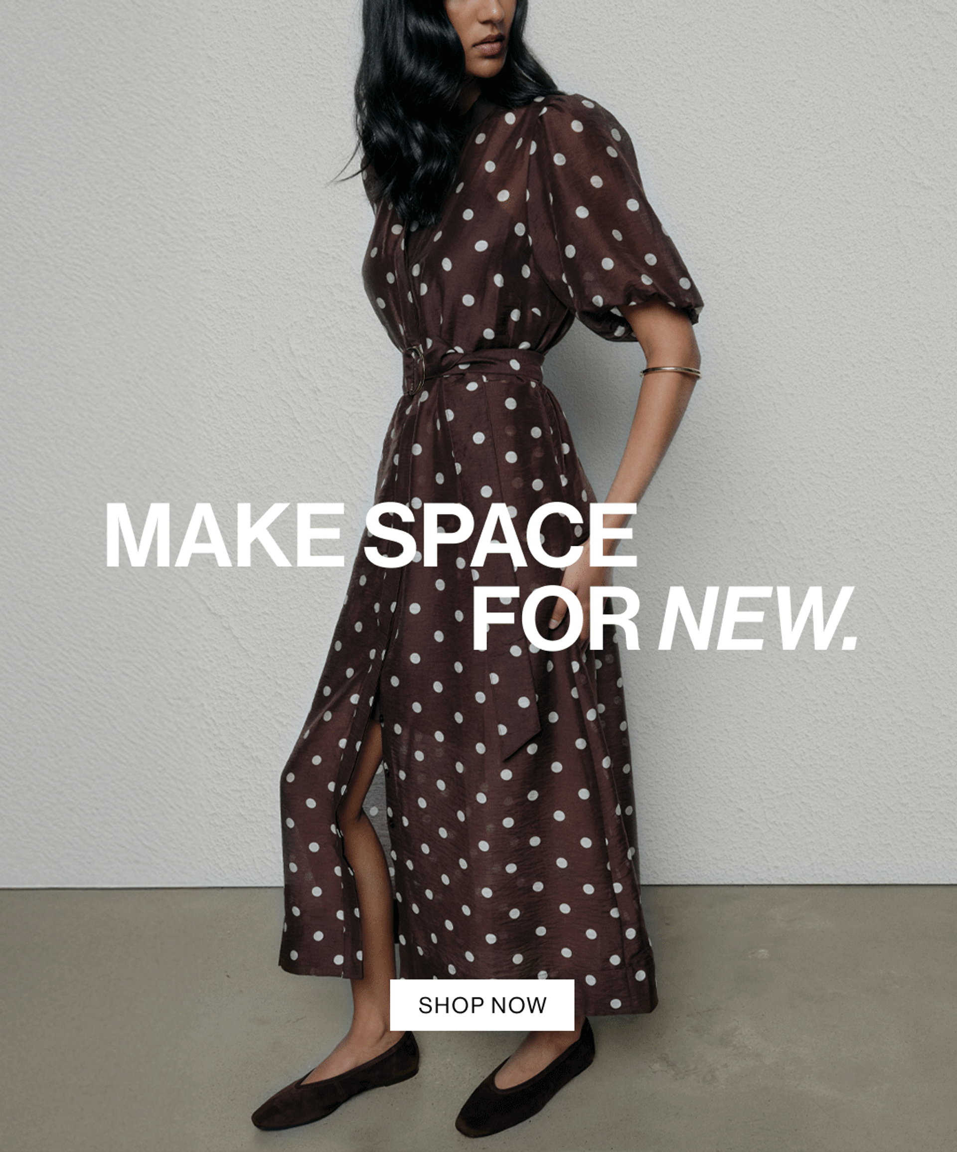 Woman wearing a flowing brown polka dot dress, sitting gracefully in a modern chair. Text reads "make space for new."