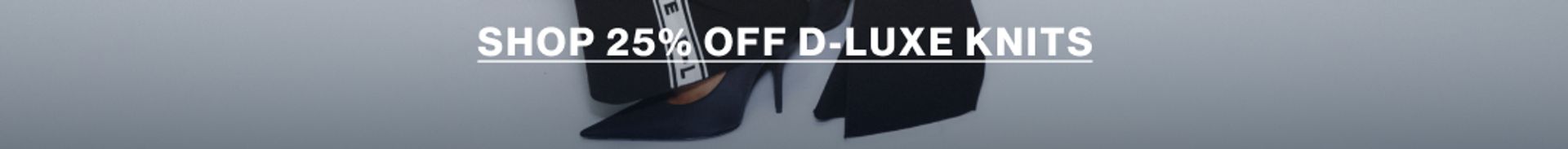 Model in a leather jacket standing in front of a white wall with text overlay which states "20% OFF DLUXE BASICS"