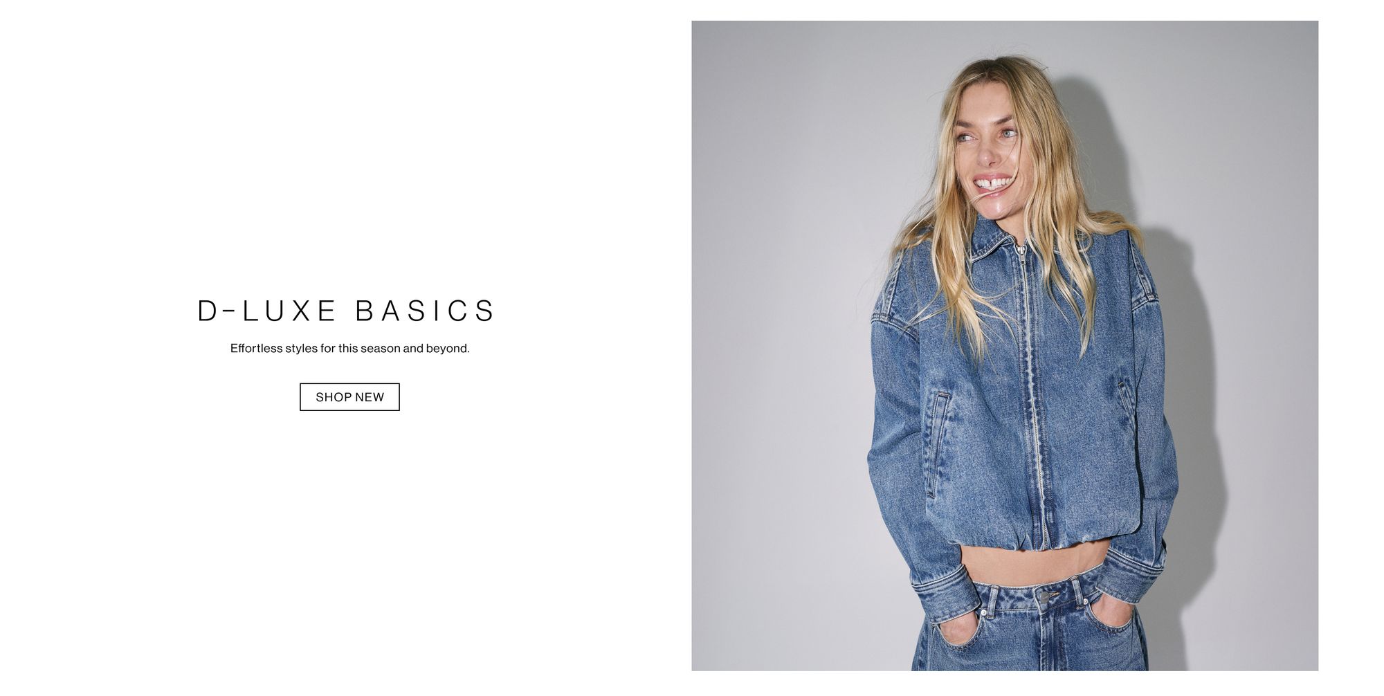 Model in a denim jacket and jeans posing with her hands in her pocket against a white wall with one hand in her pocket. Text reads ‘DLUXE basics: the latest essentials for this season and beyond.'