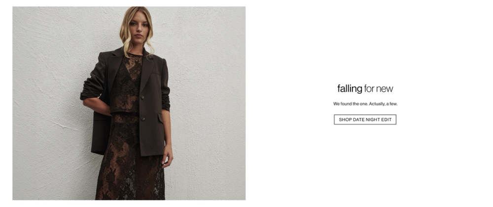 Woman standing in front of a white wall wearing a brown lace set and a blazer