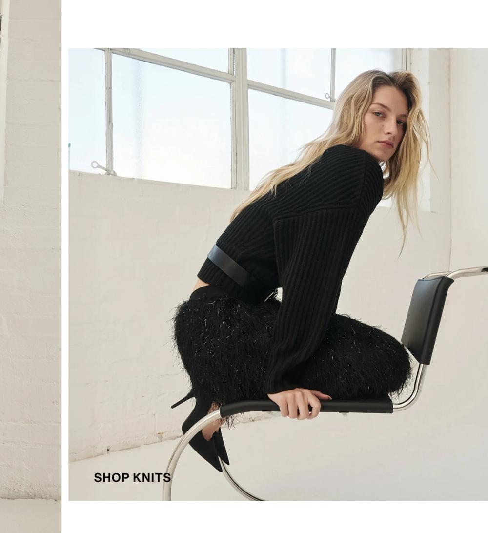 Woman posing in a black knit