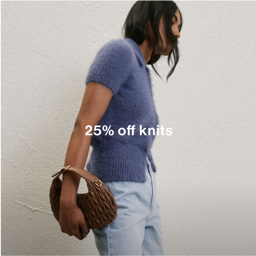 Woman posing in front of a white wall wearing a blue collared knit with text that states "25% off knits"
