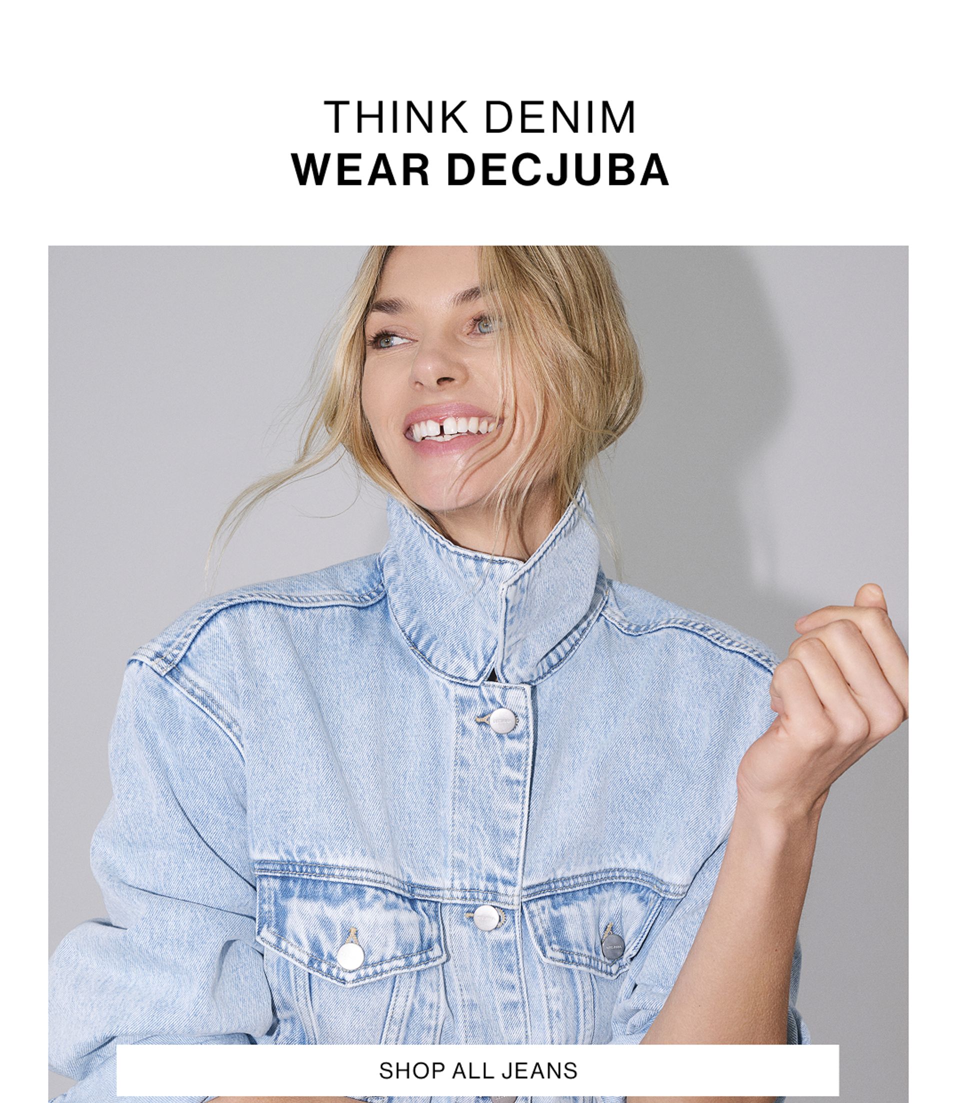 Model in a denim jacket standing in front of a white wall with text overlay which states shop all jeans