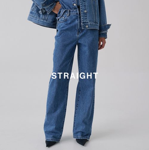 Model standing with one hand on her hip, wearing a matching denim set which has text overlay straight