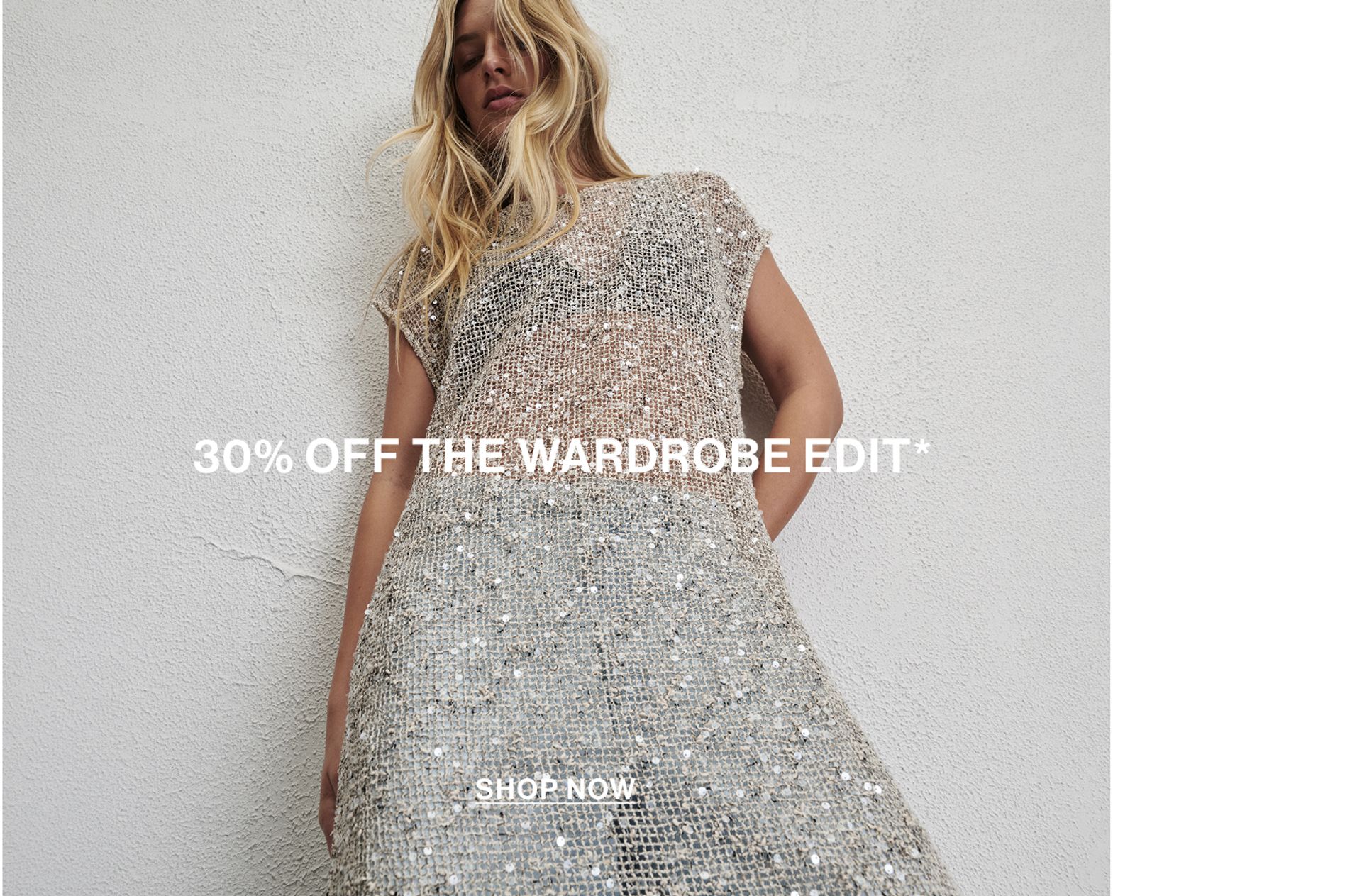 Model wearing a white sequin dress with text overlay: "30% OFF THE WARDROBE EDIT"