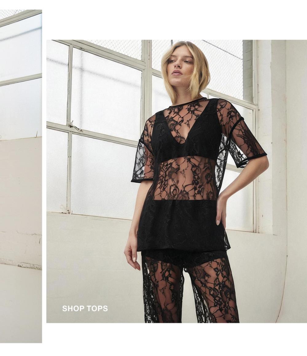 Woman posing in a black lace top 
