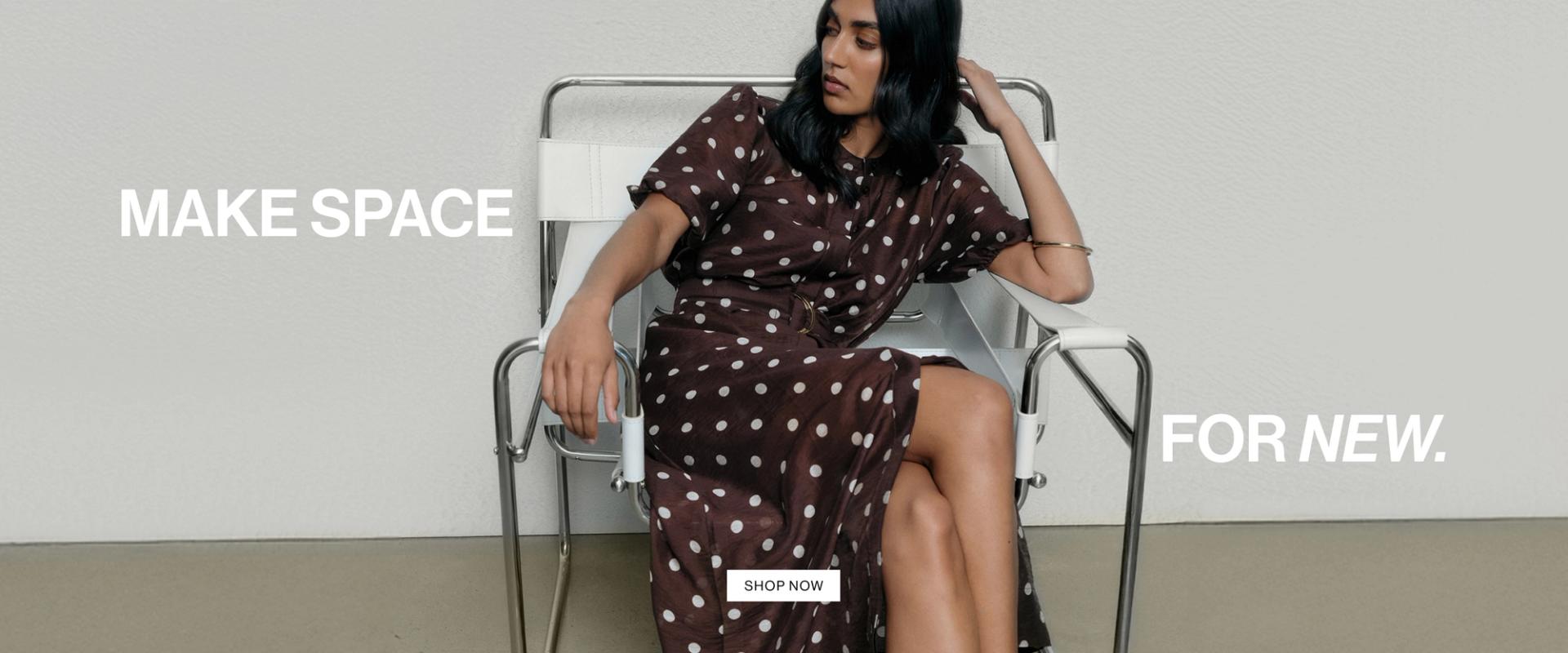 Woman wearing a flowing brown polka dot dress, sitting gracefully in a modern chair. Text reads "make space for new."